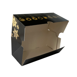 Boîte bûche noire avec motifs dorés ouverte.